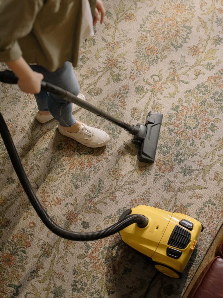A woman vacuums