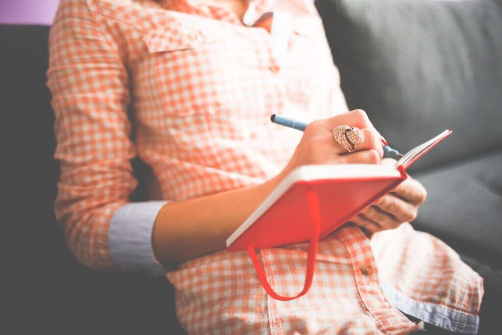 A woman Gratitude Journaling to cultivate appreciation