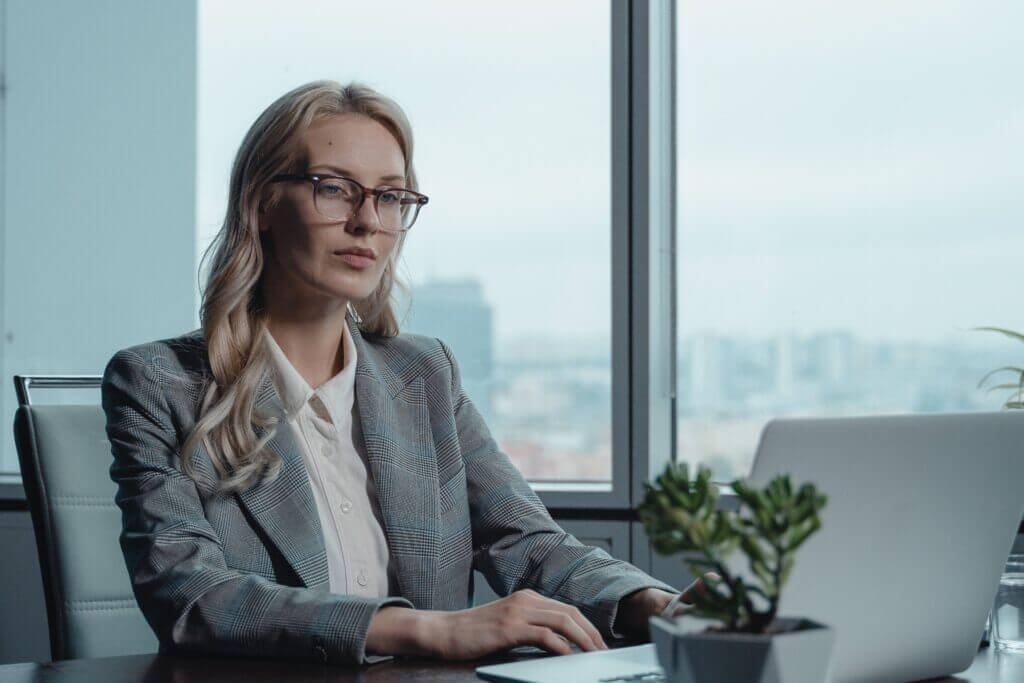 A working mother at work on a computer