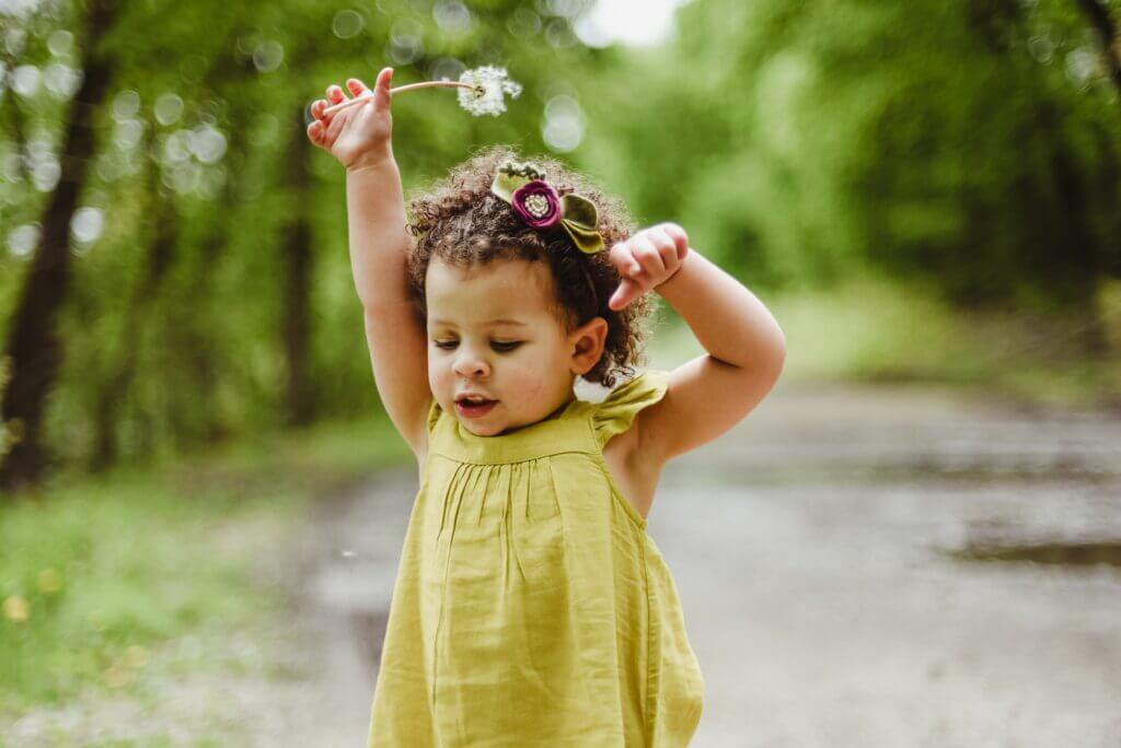 No diy toddler activities A toddler plays with a dandelion. No diy toddler activities