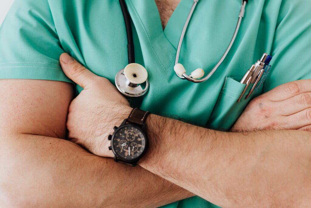 A doctor crosses their arms A doctor crosses their arms