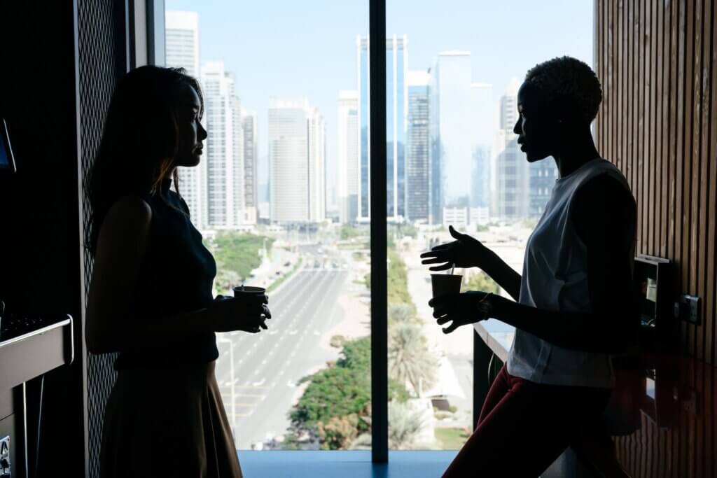 A woman fighting stay at home mom burnout by having coffee with a friend