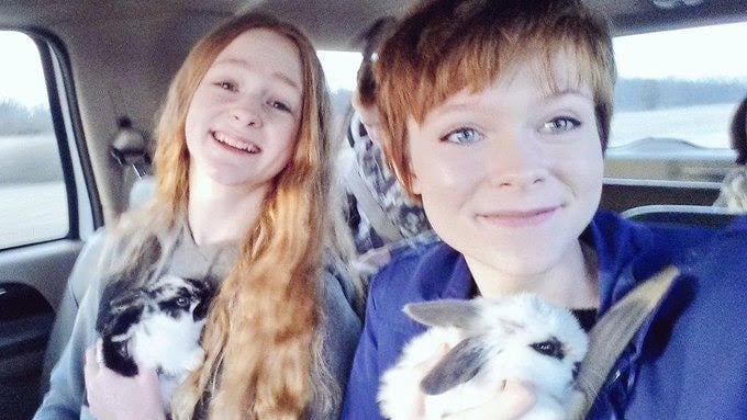 Me and my sister (I was about 16 here) with another two of my rabbits. Mycroft on the left, and Sherlock on the right.